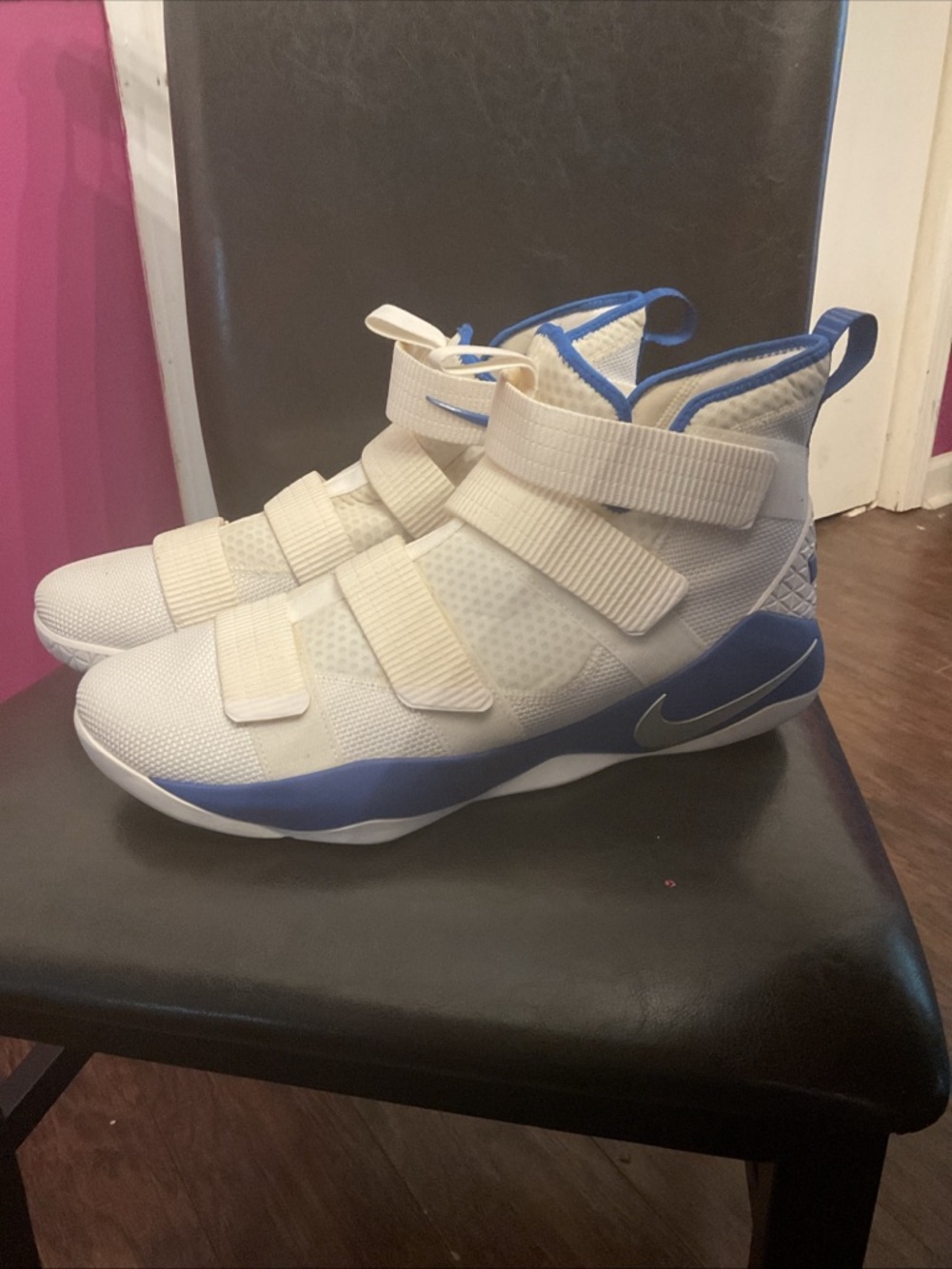 Nike LeBron Soldier High-Top Strap Sneakers in White a d blue.